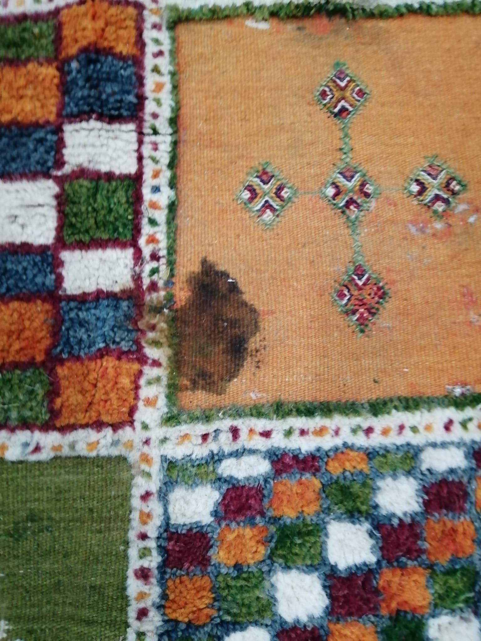 A Caucasian style wool carpet, woven with polychrome geometric squares, 430 x 260cm